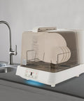 Portable Countertop Dishwasher With 360 Rotating Spray Arms And 149 Degree High Temp Cleaning on a kitchen countertop.