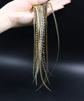 Hand holding Rooster Saddle Fly Tying Feathers Pack For Midge And Dry Fly Hackle, 9 To 11 Inches, Mixed Colors, 10 Feathers