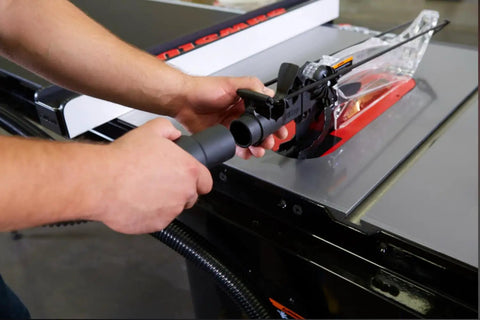 Pro Grade Dust Collection Blade Guard Assembly for Table Saws being installed, showing independent lateral guards and hose connection