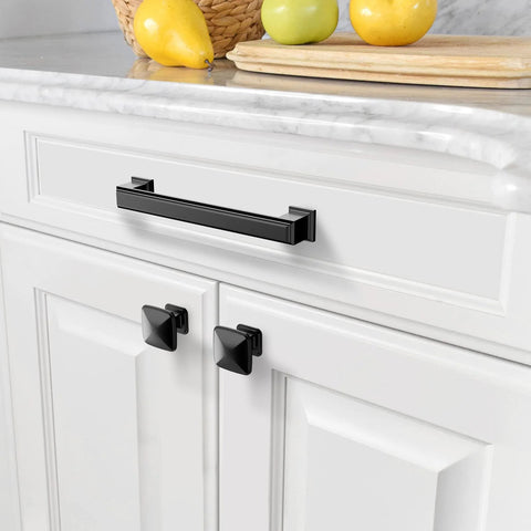 Matte Black 5 Inch Cabinet Pulls 10 Pack With 128mm Hole Centers installed on white kitchen cabinet