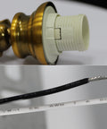 Close-up of wiring and brass finish details of Old-School Antique Brass Wall Sconce With Two Heads, Beveled Crystal Shade.