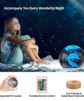 Girl sitting with Lit 3D Axolotl Crystal Ball Night Light With 16 Color LED And Wooden Base, depicting serene night scene.