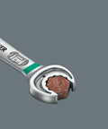 Close-up of Joker Ratcheting Combination Wrench showing holding jaw with a hex bolt, highlighting double hex design for grip.