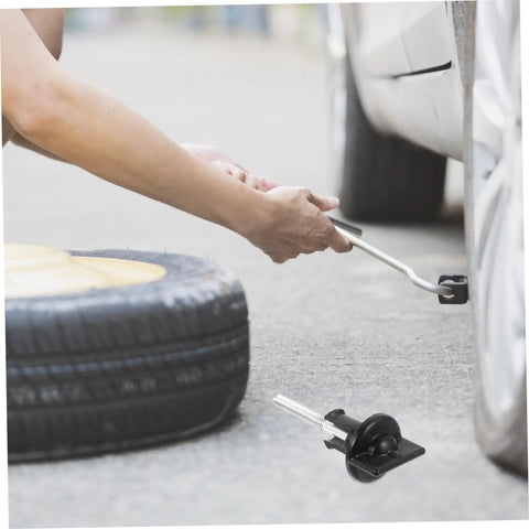 Spare Tire Bolt Hold Down Clamp For Easy Install Wheel Retainer Keeps Spare Tire Secure And Quiet In Trunk Heavy Duty Steel Construction Rust Resistant Car Accessory beside tire.