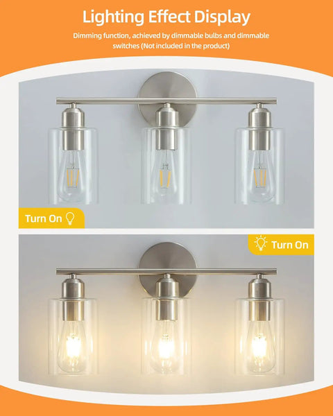 Three Light Bathroom Vanity Light Fixture in Brushed Nickel with Clear Glass Shades over Mirror Wall Sconce, dim lighting display