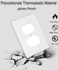 Durable Duplex Wall Plate 1-Gang Switch And Outlet Cover In White Unbreakable Thermoplastic Faceplate displayed on cracked surface