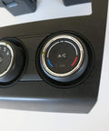 Close-up of Subaru Heater Control Assembly with 4-position push button switch and rotary actuator, black finish, genuine part 72311SG010.