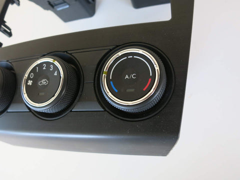Close-up of Subaru Heater Control Assembly with 4-position push button switch and rotary actuator, black finish, genuine part 72311SG010.