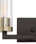 Ainsley Court Vanity Bath Light Two Light Fixture in Aged Kinston Bronze with Brushed Brass Highlights, ribbed glass shade close-up.