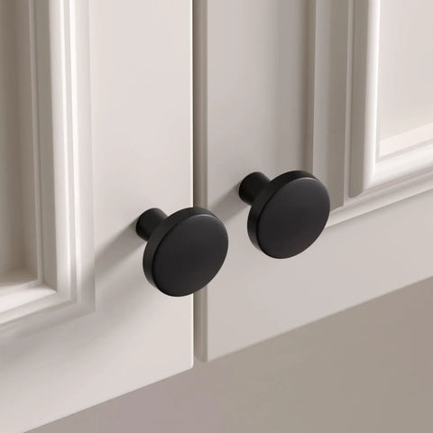 Close-up of matte black cabinet knobs from 25 Pack Matte Black Cabinet Knobs Set For Kitchen Cabinets And Dressers, Dope Zinc Alloy.
