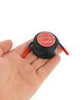 Two Pack Self Activating Fire Extinguisher Stickers No Sweat Auto Fire Defense Straight Up Heat Detection Patches For Cars And Garages in hand.