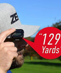Close-up of Voice 2S Plus Talking Golf GPS Rangefinder with Clip On Hat Mount, showing real-time 129 yards distance measurement.
