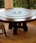 Big Boy Sized Round Lazy Susan With Dead Silent Glide 360 Degree Rotation Serving Tray on a wooden table with a glass top.