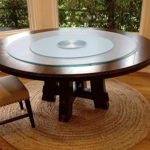 Big Boy Sized Round Lazy Susan With Dead Silent Glide 360 Degree Rotation Serving Tray on a wooden table with a glass top.