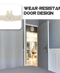 Fluffy White Door Stopper For Home And Office Soft Durable Wall Protector on a gray wall with open door