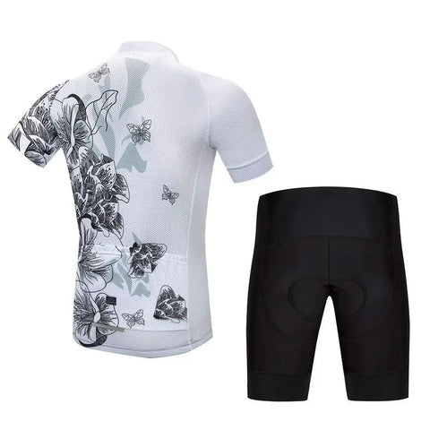 White cycling jersey with floral print and black padded cycling shorts, rear view