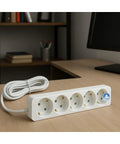Six Outlet Power Strip With 16 Foot Cord Heavy Duty Extender grounded power strip on a desk with books in background.
