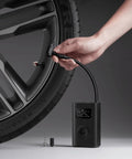 Using Portable Electric Air Compressor 2 With 150 Psi, Fast Inflate For Cars, Trucks And Bikes on a car wheel