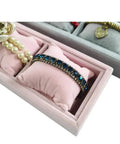 Keep Your Daily Carry Looking Sharp With This Grey Velvet Watch Tray And Jewelry Organizer Set Featuring Four Spacious Grids Wrapped In Plush Mini Pillows For Sleek Bracelet Display And Zero Clutter, showing blue jeweled bracelet and pearl jewelry in soft cushions.