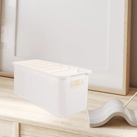 Slick White PP Plastic Drawer Organizer Box With Comfortable Handle Grip For Quick Sorting Bras Socks Ties And Everyday Gear To Keep Your Room Neat On The Daily on a wooden surface.