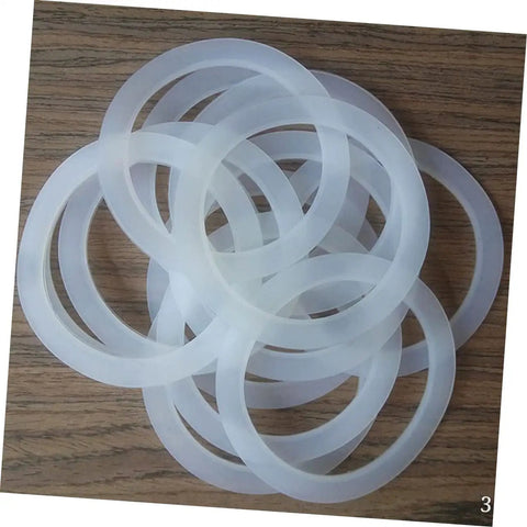 5 Pack Silicone Sealing Rings Replacement Gaskets For Coffee Pot Lids Espresso Pots And Canning Jars on wood surface