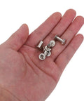 Hand holding M5 Iron Chicago Screws, silver color, ideal for bag repair, jean fastening, 110 Piece Heavy Duty Rivet Hardware Set.