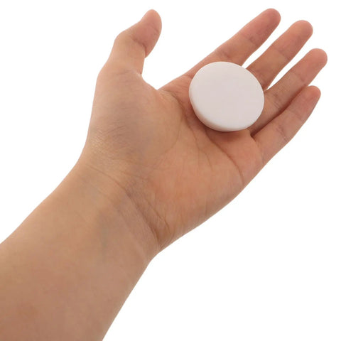 Silicone Bathtub Jet Cover Stopper White 5pcs for 30-31mm Openings in a hand demonstrating size and design.