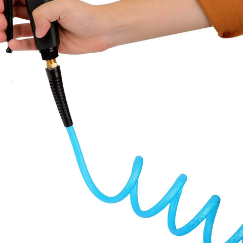 Hand holding a Badass 1/4 Inch Coiled Polyurethane Air Hose For Air Compressors With Swivel Fittings and Bend Restrictors.