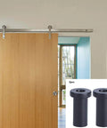 Built Tough Bottom Spacers For Sliding Barn Doors, Matte Black Wall Spacers With Door Shaft Pins, Pack Of 2 shown next to installed door.