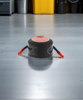 Top Shelf Emergency Essentials For Your Daily Driver Solid Compact Auto Fire Suppressor With Instant Aerosol Activation, 10 Gram Kit on floor.