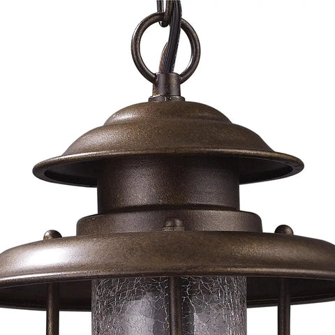 Close-up of the top of Wikshire 8 Inch Wide 1 Light Outdoor Pendant in Coffee Bronze with cast aluminum and clear crackle glass.