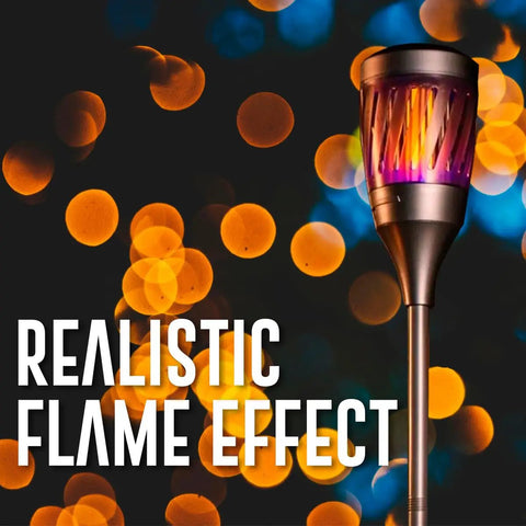Solar Powered Tiki Torch Lantern Zapper With Realistic Flickering Flame against a backdrop of blurred lights