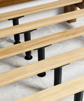 Two Pack Adjustable Bed Frame Support Legs Heavy Duty Load Bearing Composite Furniture Feet shown under a wooden bed frame.
