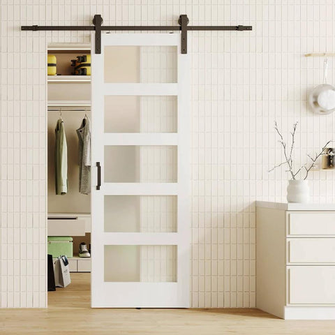Glass And Wood Barn Door Kit 30In X 84In With Frosted Five-Panel Glass, White Primed MDF Panel, shown installed in a room.