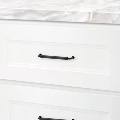 Hollywood Hills 4486 Cabinet Pull 6 Inch Center To Center Solid Brass Hardware installed on a white kitchen drawer.