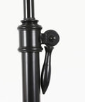 Close-up of adjustable mechanism on Oil Rubbed Bronze Floor Lamp With Adjustable Height And White Linen Shade, Steel Construction.