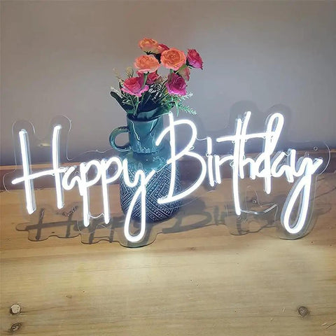 Birthday Neon Sign LED Wall Backdrop 23.6x9.45 Inches Custom Party Neon Light displayed in front of a vase with flowers on a table.