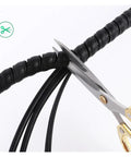 Close-up of scissors cutting black Spiral Cable Sleeve Wrap For 8 To 60 Millimeter Wires, Durable PP, Flexible Wire Protection