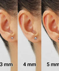 White Gold Ball Stud Earrings 6mm Set With Real 14K Gold, Ultra Bright High Polish Mirror Finish That Refracts Light, Tarnish Resistant, Secure Push Back Closures, Everyday Sparkle That Looks Dope For Work Or Night Out. 3-5 mm white gold ball stud earrings on ear