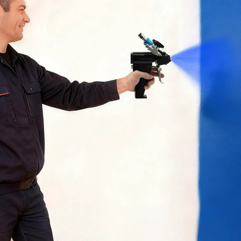 Heavy Duty PU Foam Spray Gun With Air Purge And Slick Self Cleaning Point Zero Zero Four Nozzle spraying blue paint on a wall.