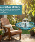 Sun Powered Hanging Bird Bath Fountain With Glass Bowl Cascade Solar Pump No Wiring Outdoor Water Feature For Garden Patio Or Yard In Blue That Attracts Backyard Birds And Runs Automatically In Sunshine Super Easy Setup on a tree branch with a bird, outdoor setting.