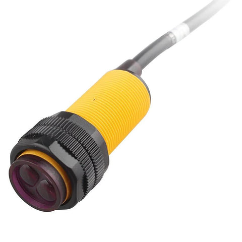 Close-up of Infrared Photoelectric Switch Obstacle Avoidance Sensor Module E18D80NK with yellow housing and cable