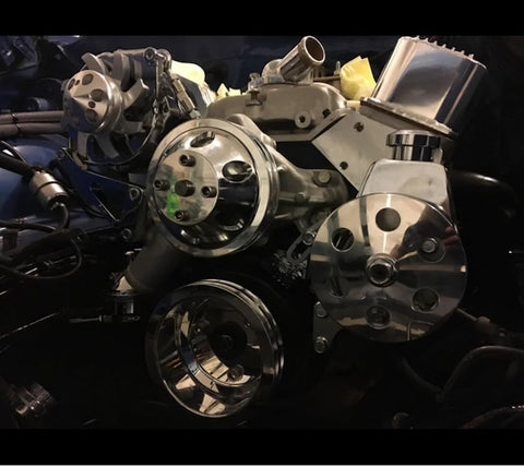 Close-up of chrome high output 200 amp one wire alternator installed on Chevy Holden SBC BBC V8 engine with custom billet aluminum pulley.