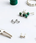Dope M5 Iron Chicago Screws For Bag Repair And Jean Fastening 110 Piece Heavy Duty Rivet Hardware Set on a crafting table.