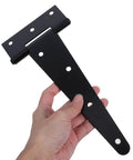 Hand holding Heavy Duty Iron Door Hinge With Extended T Shape Design And Slotted Bearing For Easy Angle Adjustments sleek black finish