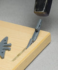 Fast Biscuit Connector Set For Wood Joints With Snap In Install In A Twenty Slot No Clamps No Glue Needed Self Tightening Durable For Invisible Strong Joints 50 Pairs being used on a wooden board