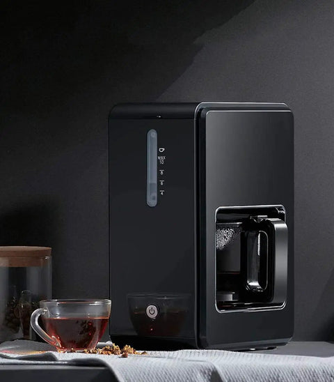 Next Level Bean To Cup Coffee Machine With Automatic Espresso Brewing and Capsule Compatibility on kitchen counter with coffee cup.