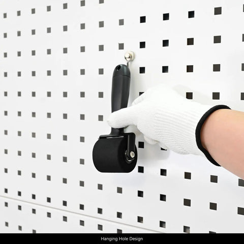 Gloved hand holding All In One Vinyl Wrap Roller Kit Pro Grade 2 In 1 Rivet Brush Applicator With Weeding Pin on pegboard