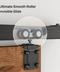 Close-up of 8 Ft Box Rail Sliding Barn Door Track Kit, Heavy Duty Aluminum Alloy Wall Mount, smooth rollers in operation