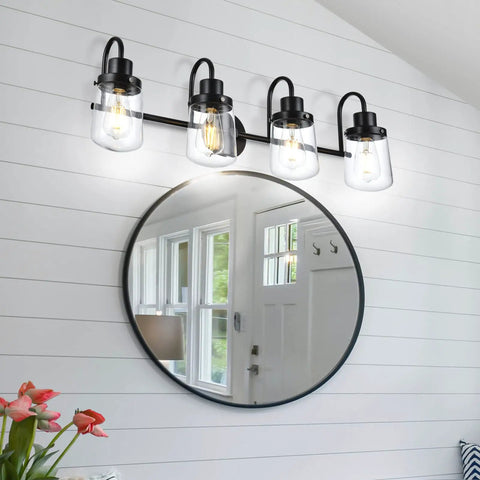 Four Light Black Vanity Light Fixtures With Clear Glass Shades Dope Industrial Wall Sconces mounted above a round mirror